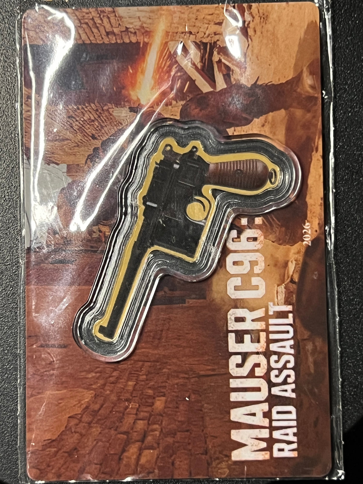 2026 Republic of Liberia 12 Dollars "Mauser C96: Raid Assault" Shaped 1/1000 oz Gold Coin — Carded Prooflike Issue