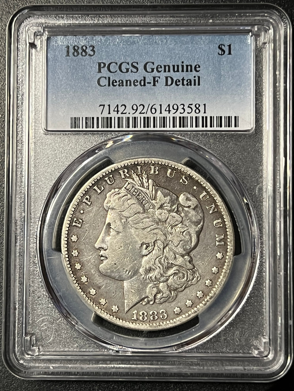 1883 Morgan Silver Dollar — PCGS Genuine (Cleaned-F Detail)