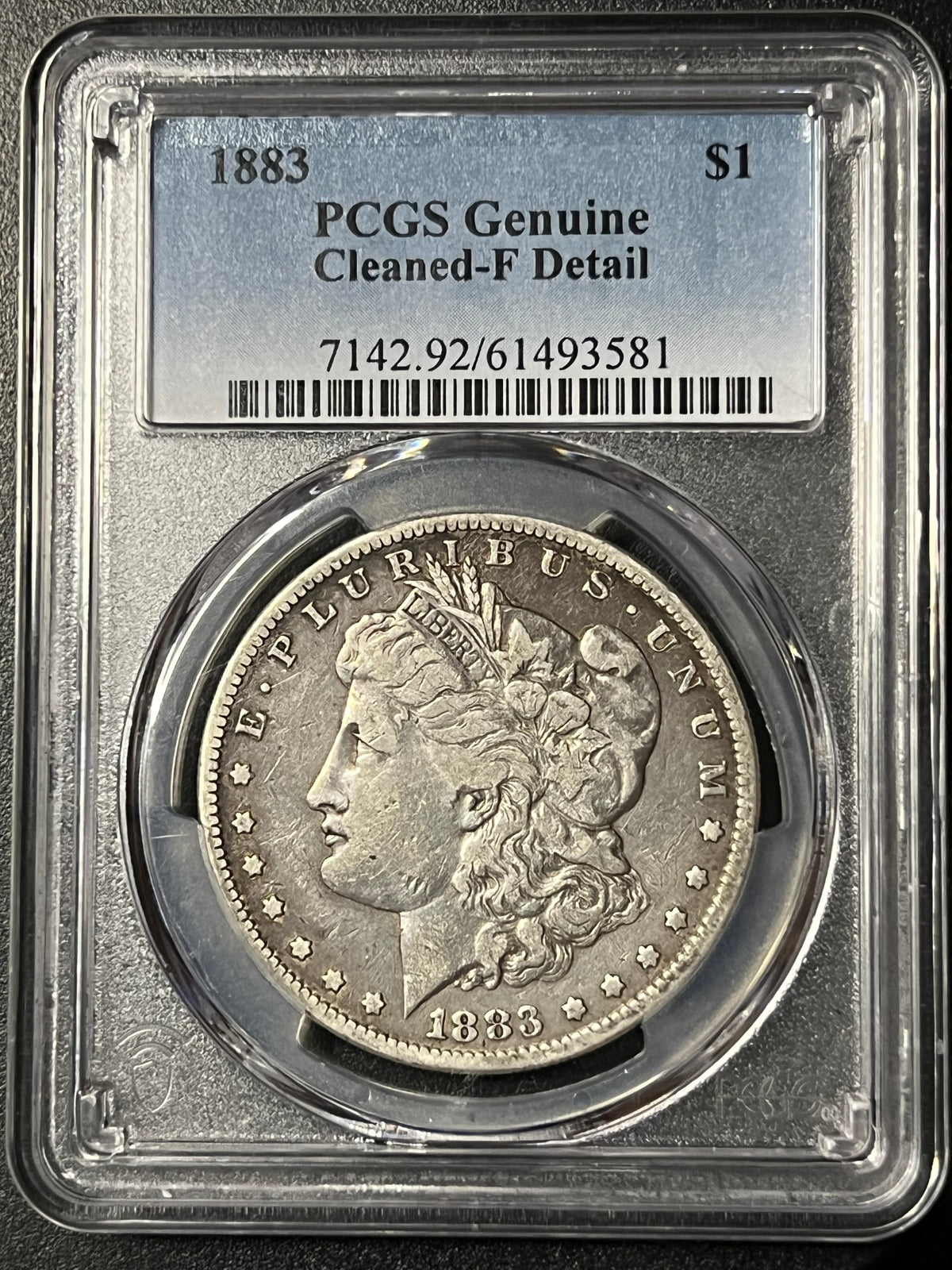 1883 Morgan Silver Dollar — PCGS Genuine (Cleaned-F Detail)
