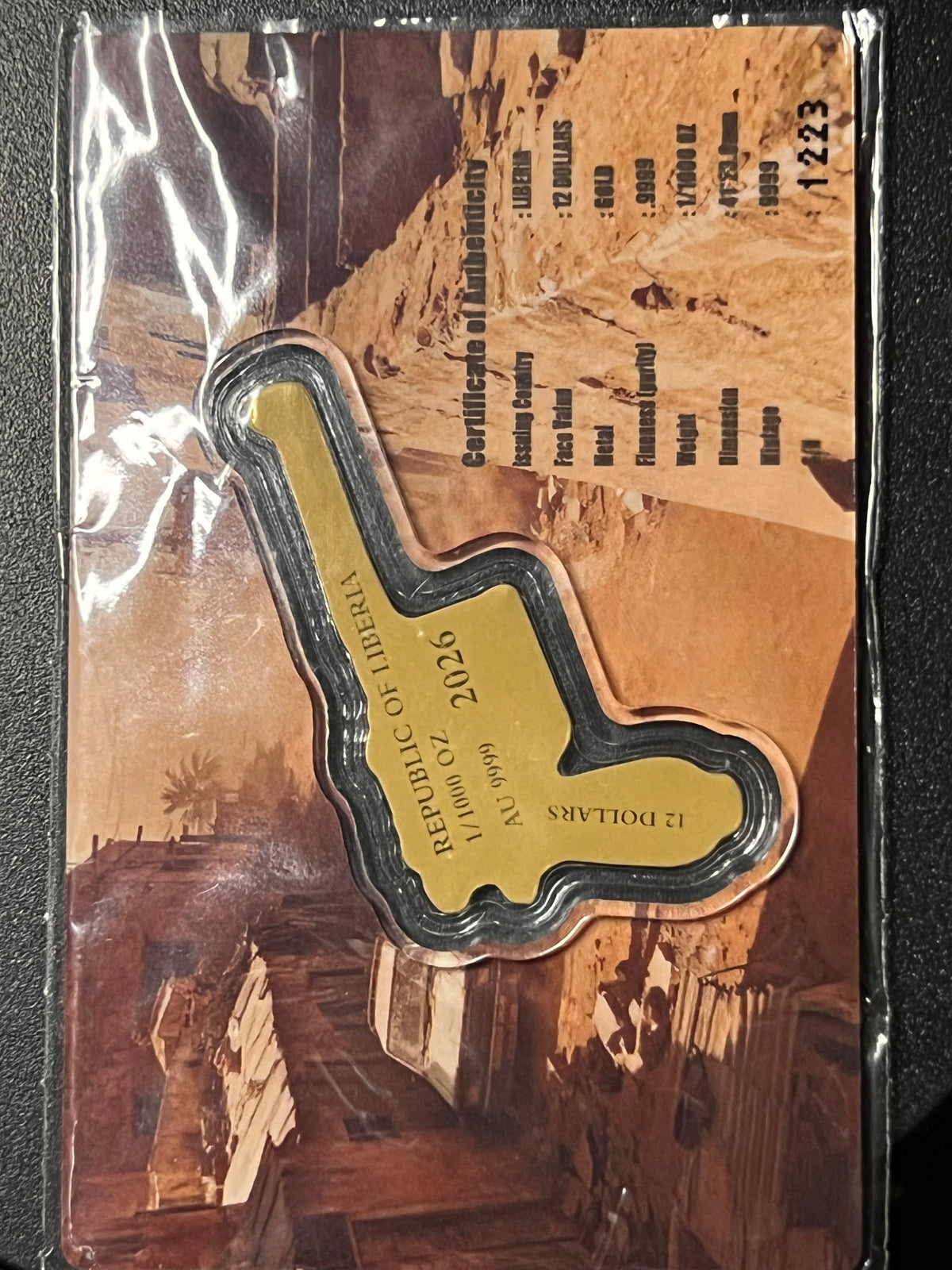 2026 Republic of Liberia 12 Dollars "Mauser C96: Raid Assault" Shaped 1/1000 oz Gold Coin — Carded Prooflike Issue